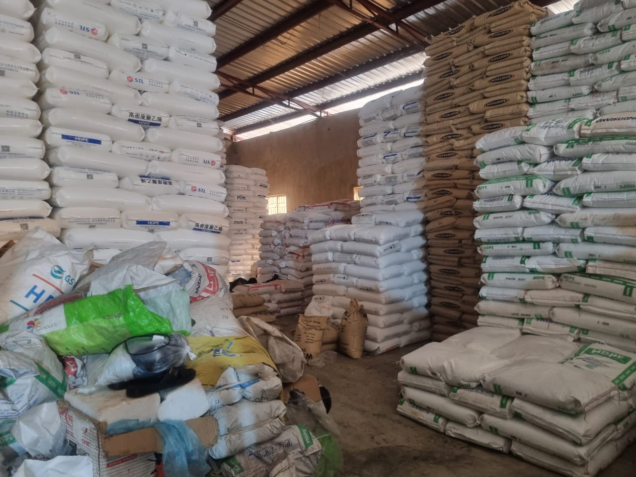 Stacks of polymer bags in the Ibadan warehouse